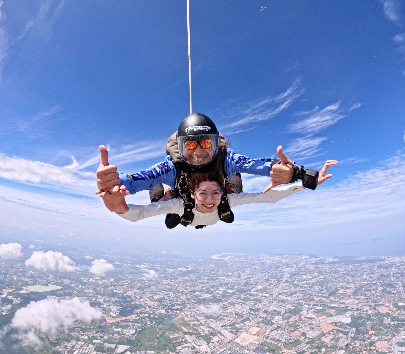 Passenger smiling at the camera in freefall