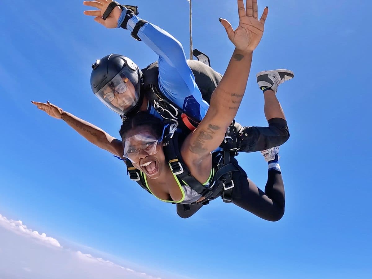 Passenger shouting with joy in freefall, arms wide open